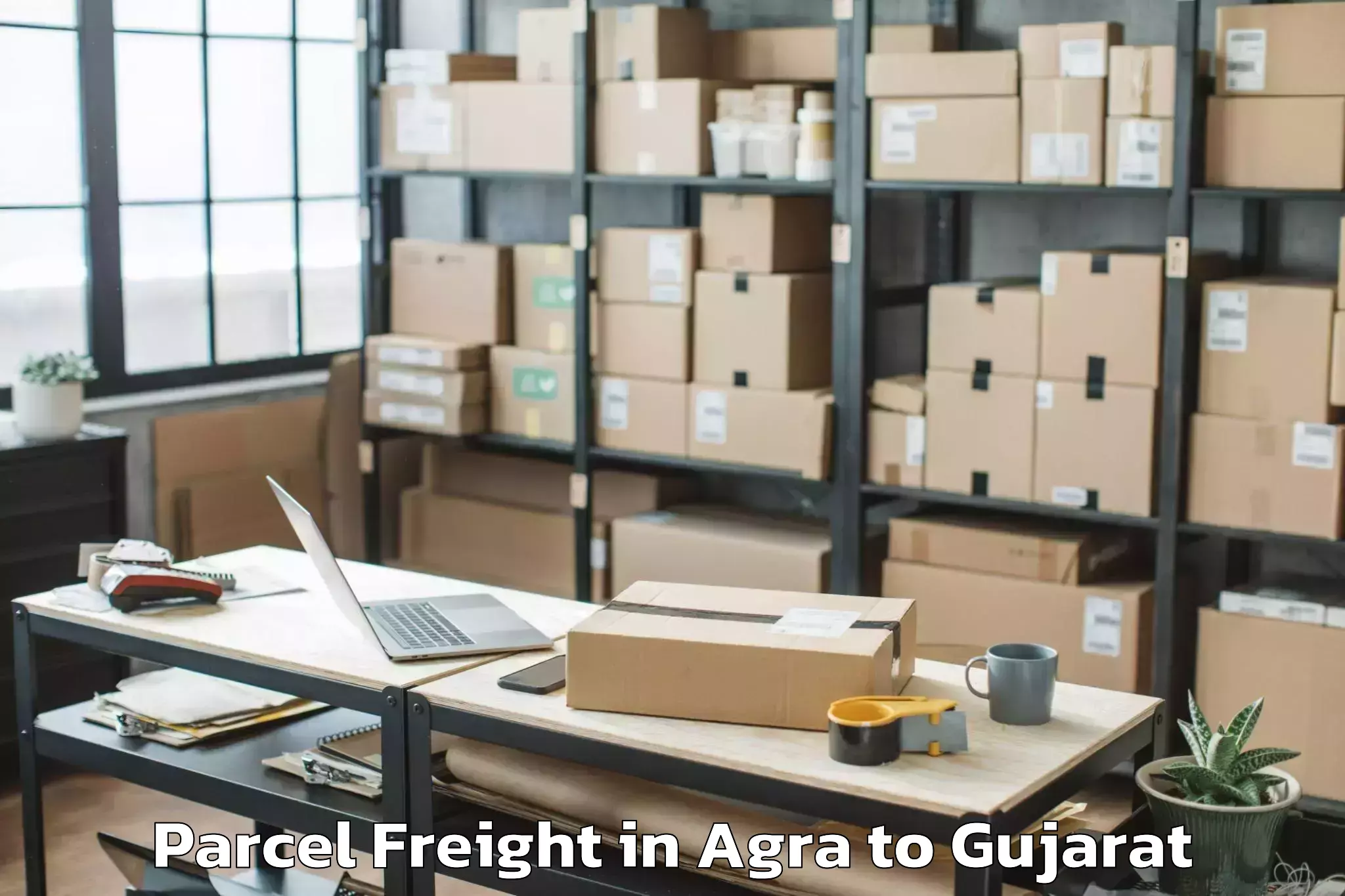 Book Agra to Bhiloda Parcel Freight Online